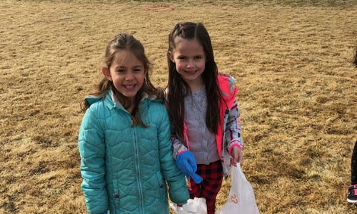 two girls with plastic bags 